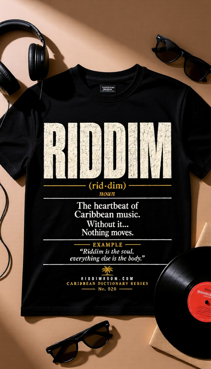 Riddim Caribbean Dictionary t-shirt on a hanger beside a vinyl record.